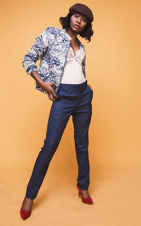 Black female fashion model in jeans and jacket