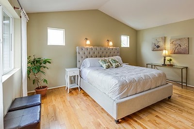 Clean bedroom with hardwood floors