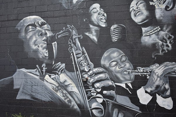 Mural of jazz greats on side of building
