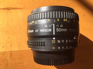 Nikkor camera lens on table
