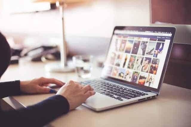 Woman using laptop at desk