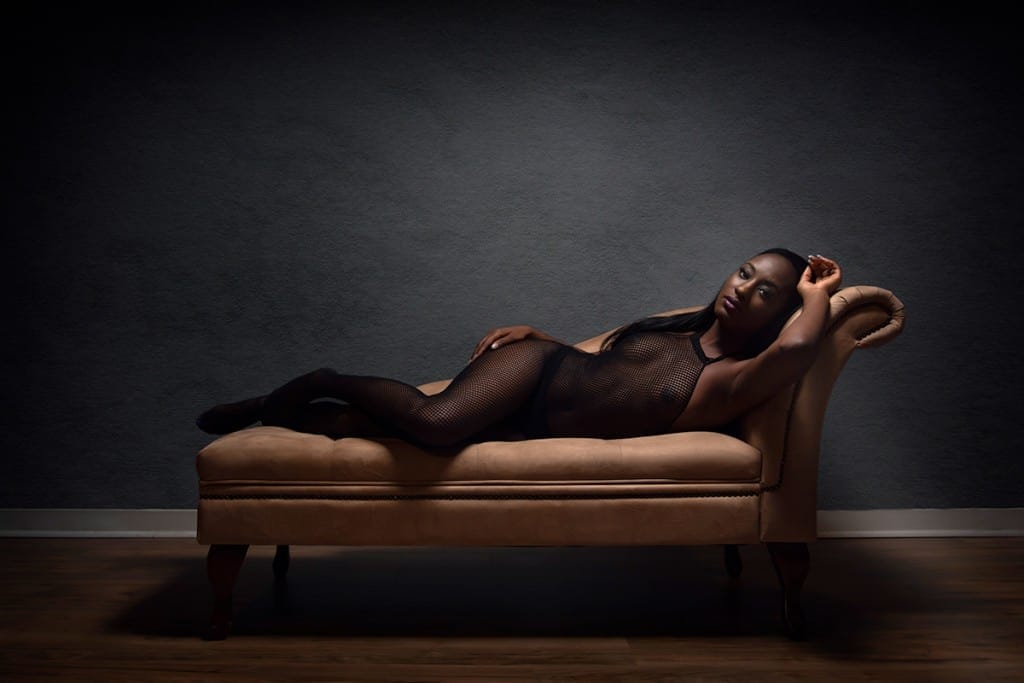 Boudoir pose on chaise lounge