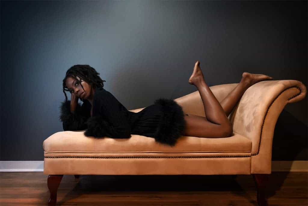 Boudoir pose on chaise lounge