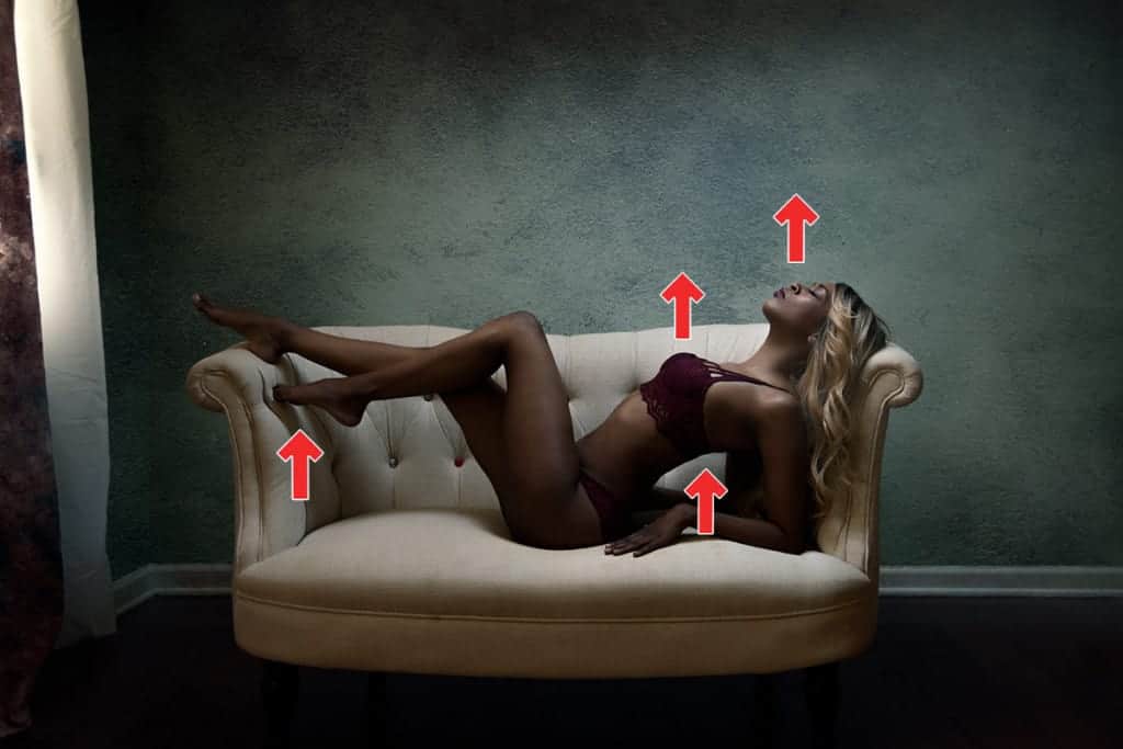 Boudoir pose on loveseat