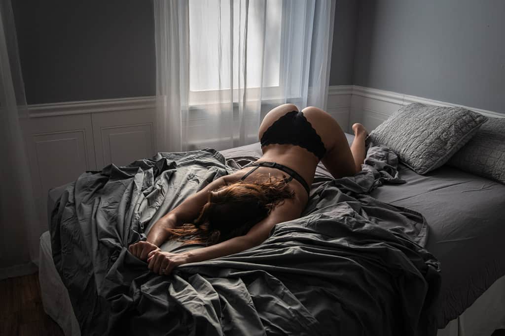 Dark and moody boudoir in natural light