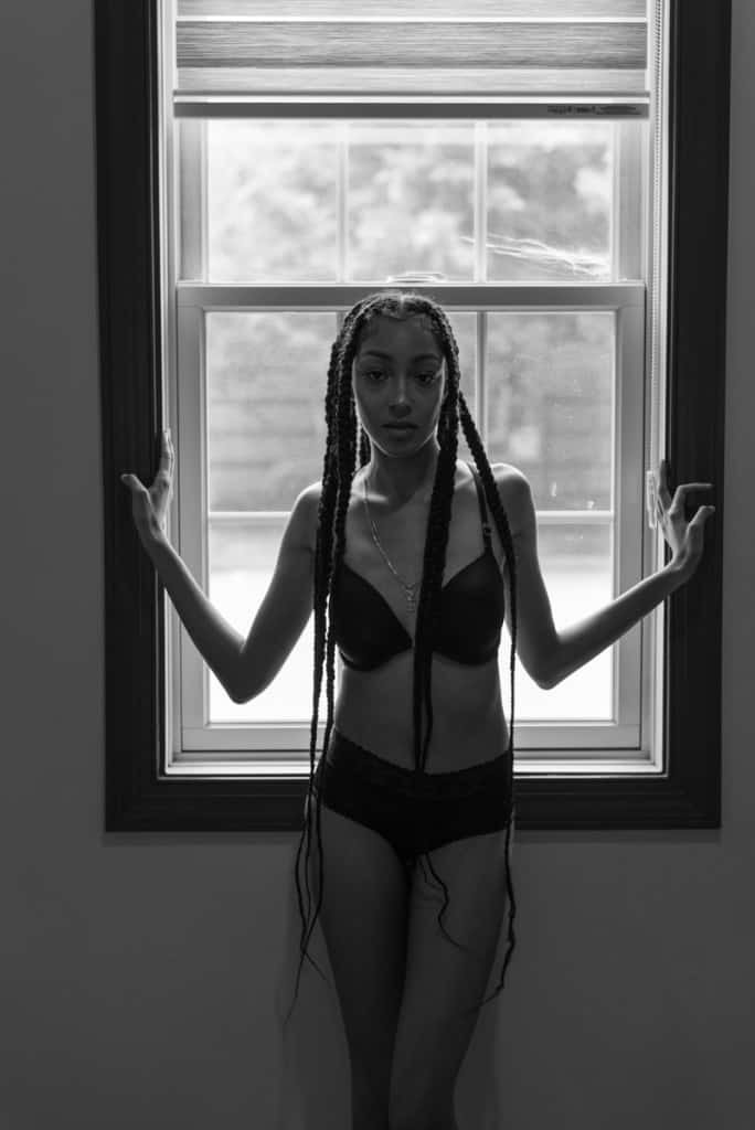Back lit boudoir pose